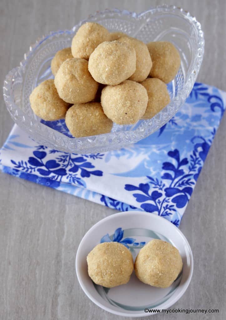 two Sesame ladoo in a small plate with more in the background