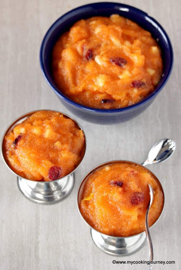 Fruit Kesari in two stainless bowls with a bigger bowl in background 