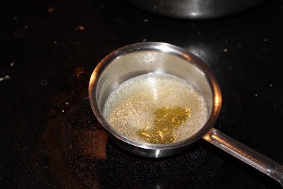 Mustard seeds in hot oil
