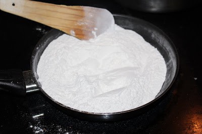 Frying the rice flour in a pan