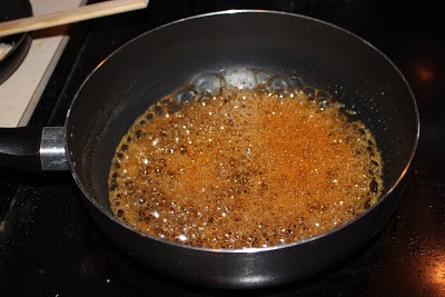 Jaggery syrup in a pan.