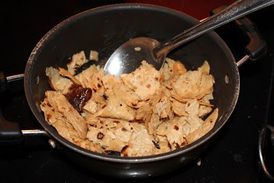 frying chapathi in a pan