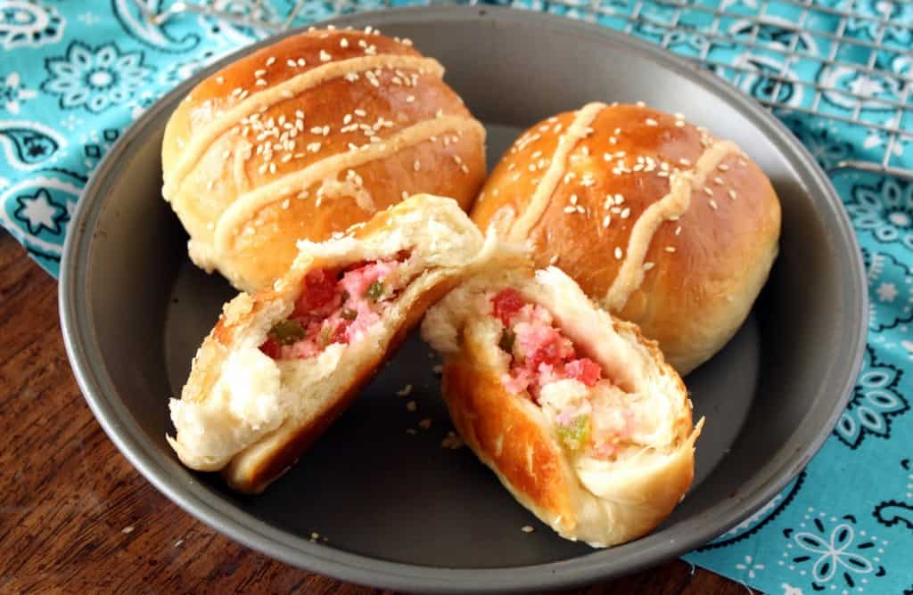 Gai Mei Bao – Chinese Cocktail Buns – Chinese Coconut Buns in Slices in a Plate