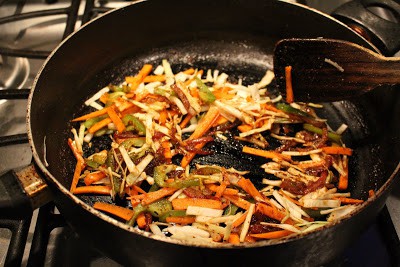 Cooking Vegetables along with sauce in a pan