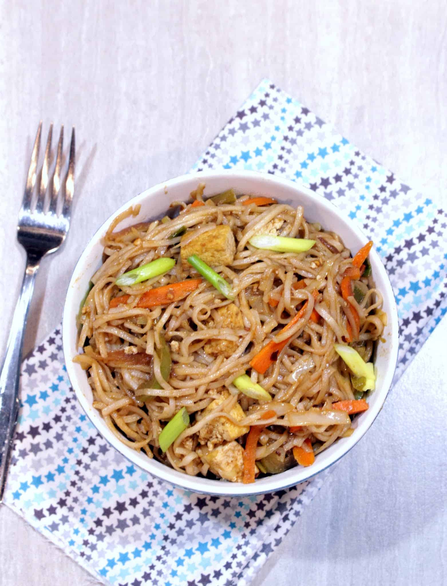 Hakka Noodles in a bowl with fork