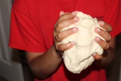 Kneading the dough for cinnamon rolls