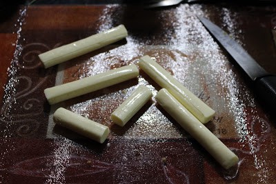 Mozzarella cut into sticks.