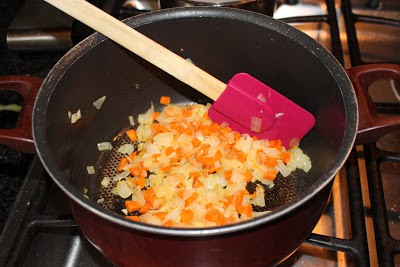 Cooking the vegetables in a pan and mixing with spatula
