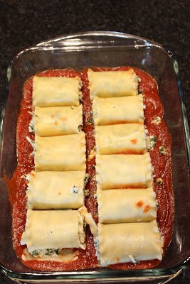 Placing the sauce and lasagna in a dish