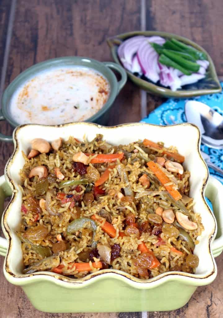 Vegetable Biriyani with yogurt in the background