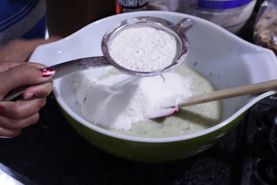 Sifting flour and adding in the batter.