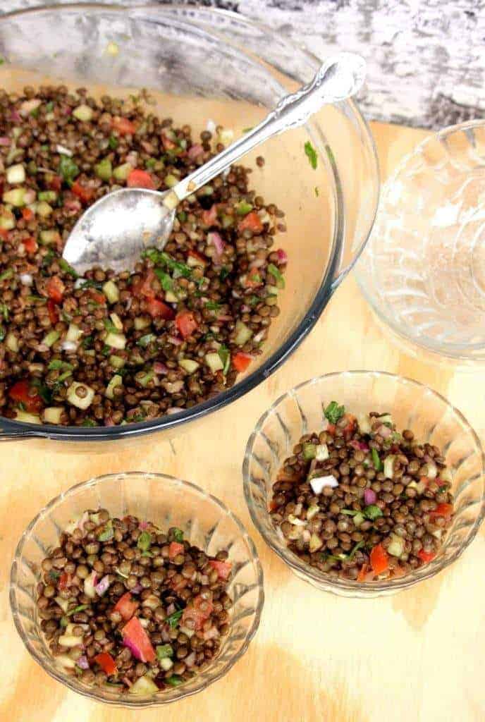 French Green Lentil Salad with Balsamic Vinegar Dressing in two small bowls and a big bowl