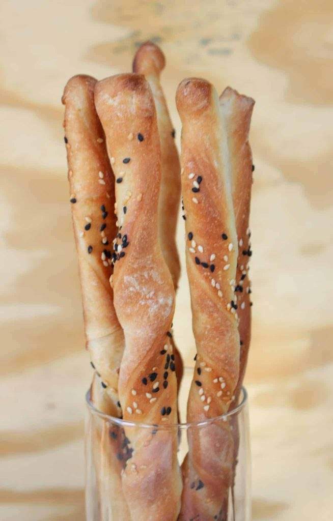 Breadsticks stacked in a glass