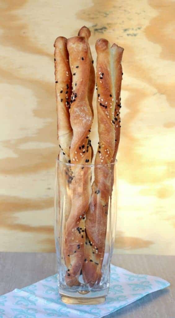 long breadsticks with sesame in a glass
