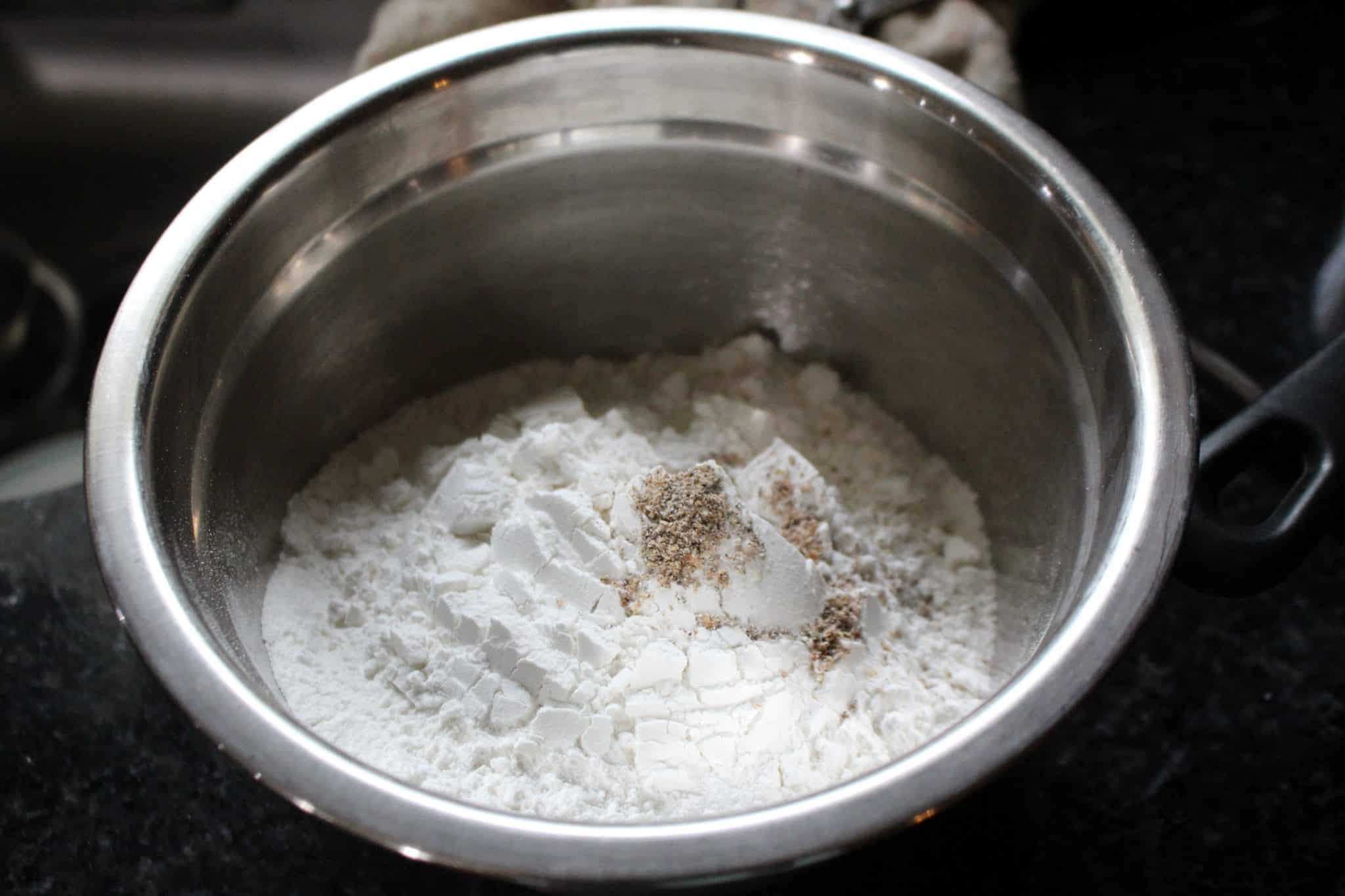 Rice flour and cardamom powder in a bowl