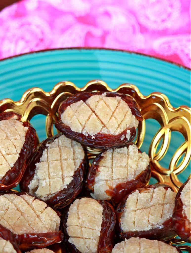 Dates stuffed with almond paste in a decorative bowl