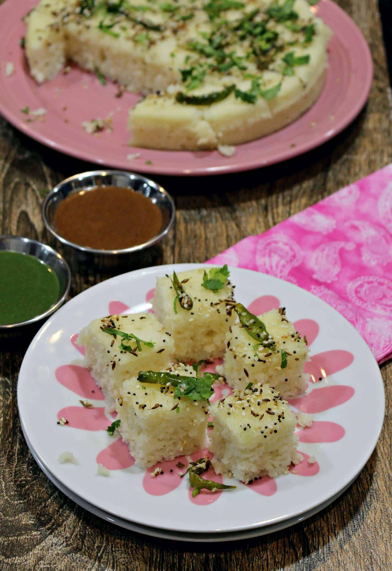 Rava Dhokla in a dish with Green and red Chutney