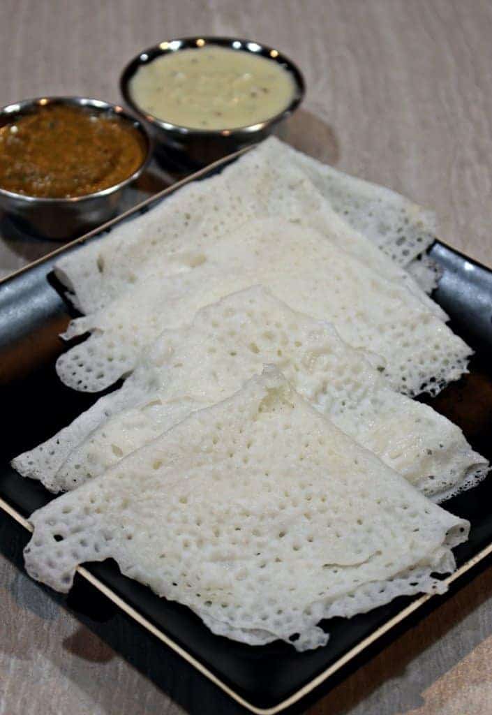 Neer Dosa in a black plate