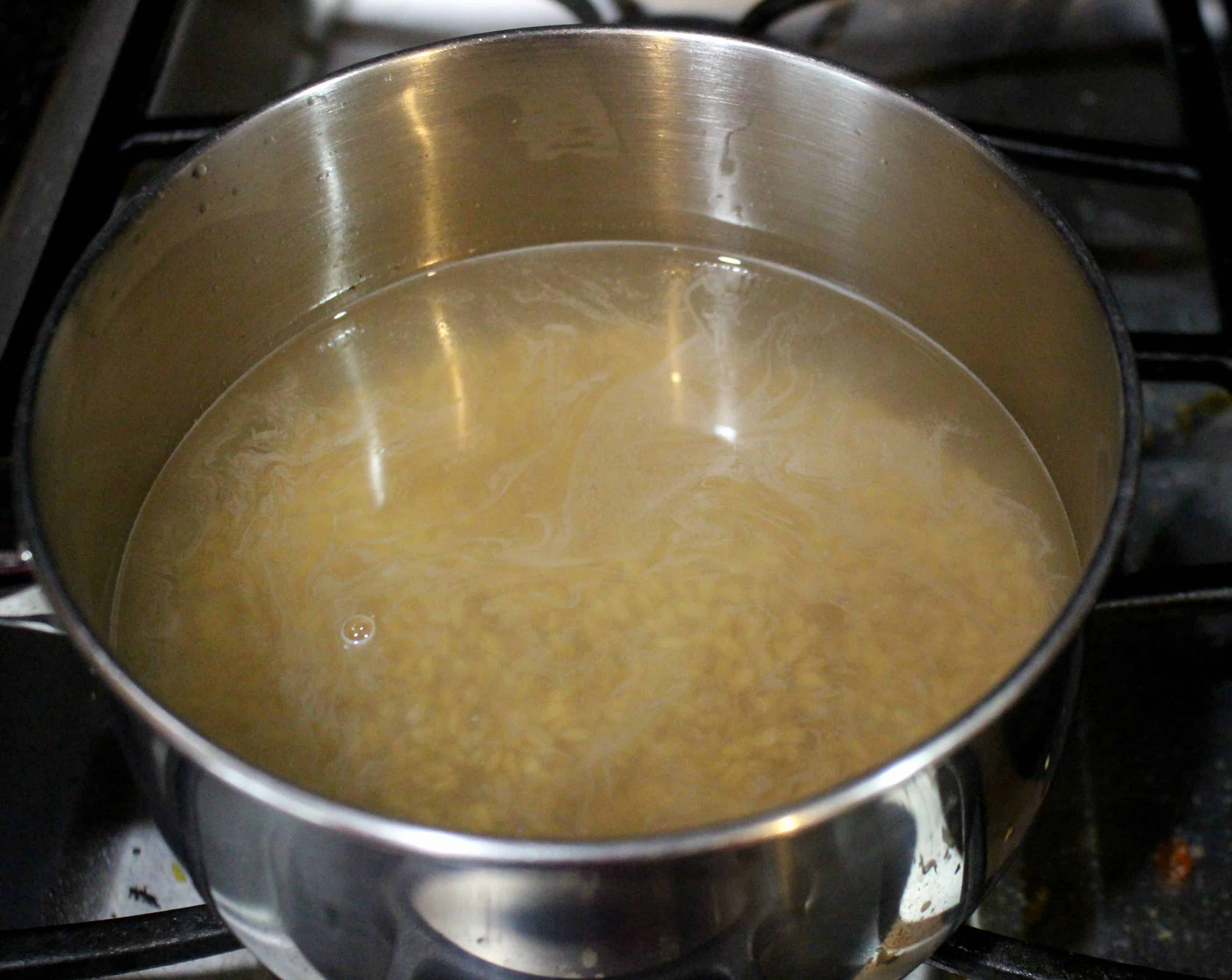 cooking farro in a pot of water