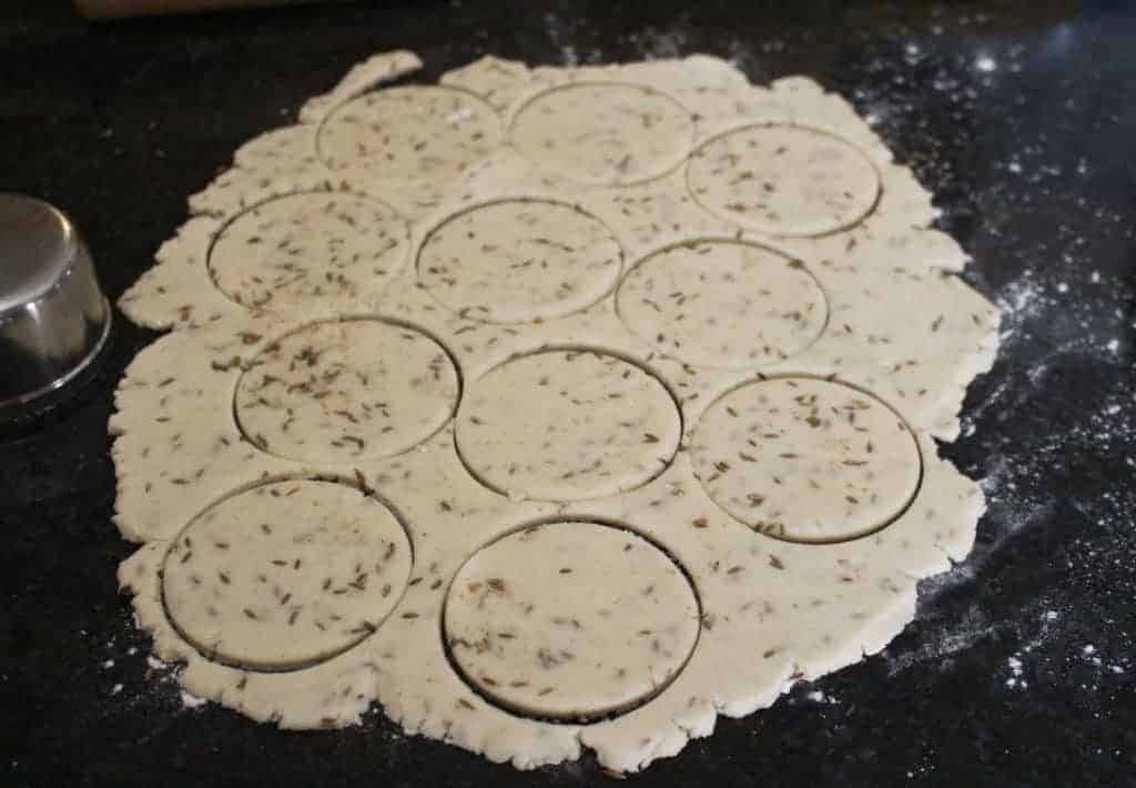 rolling the dough and cutting using a cookie cutter