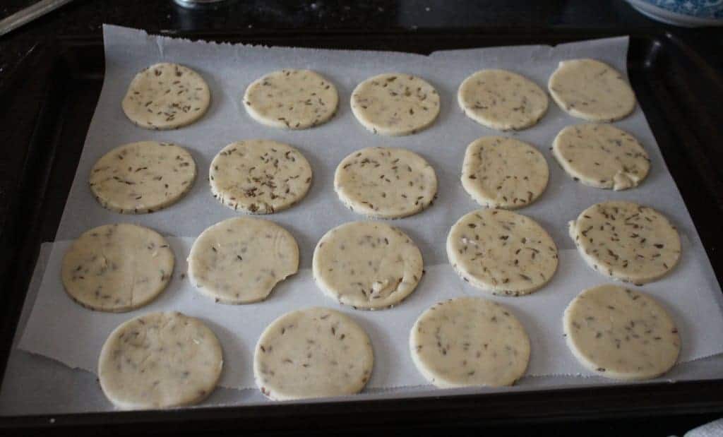 shaped cookies on a parchment paper in a tray