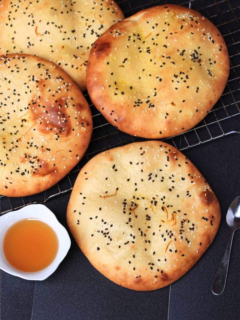 3 Emirati Khameer flatbreads with honey on the side