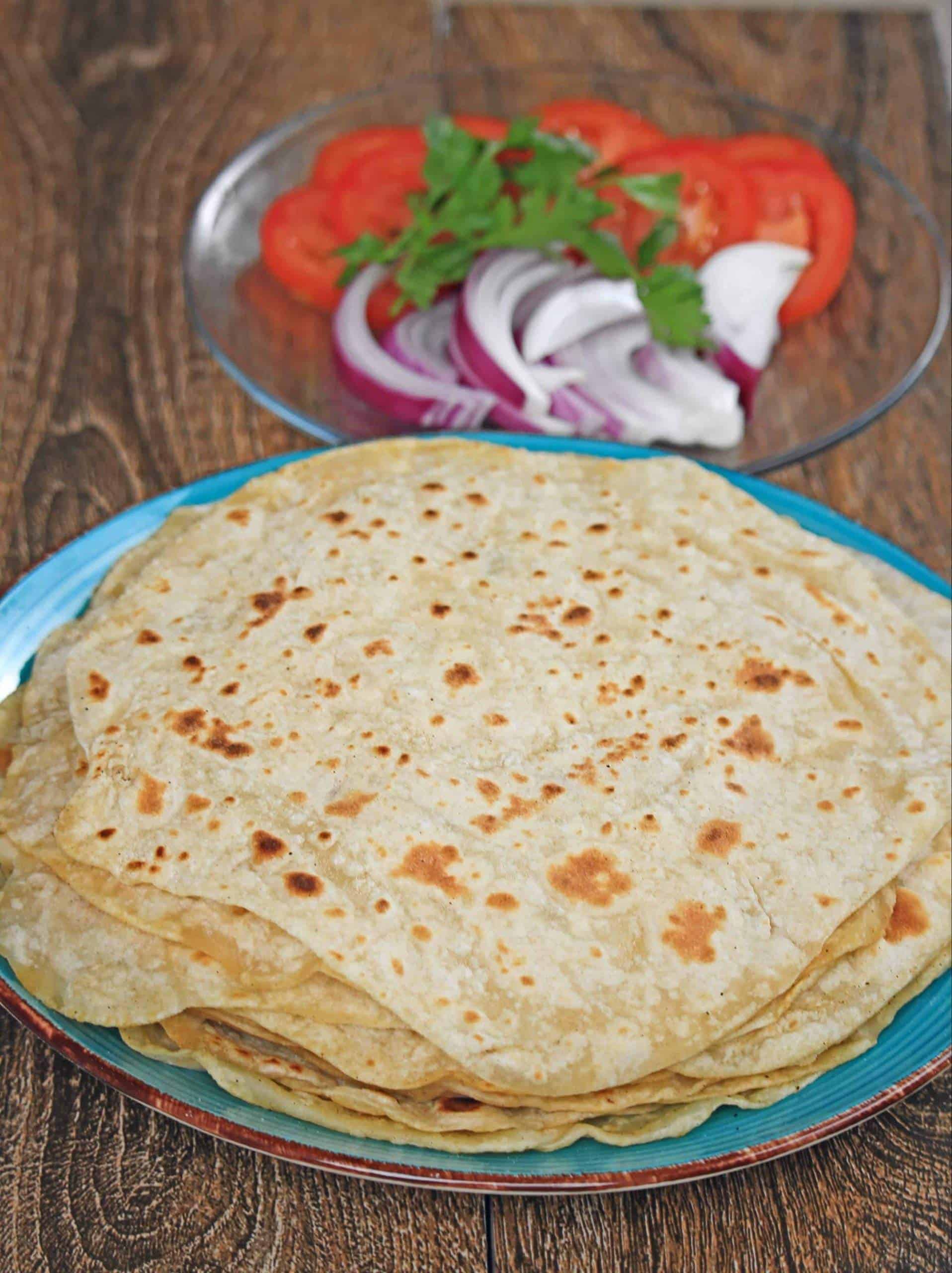 Turkish flatbread with salad in the background