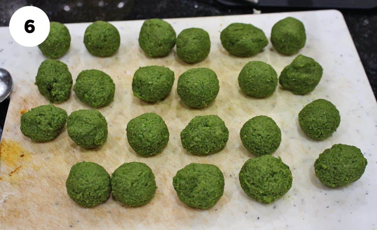 Green peas balls rolled and placed on a board