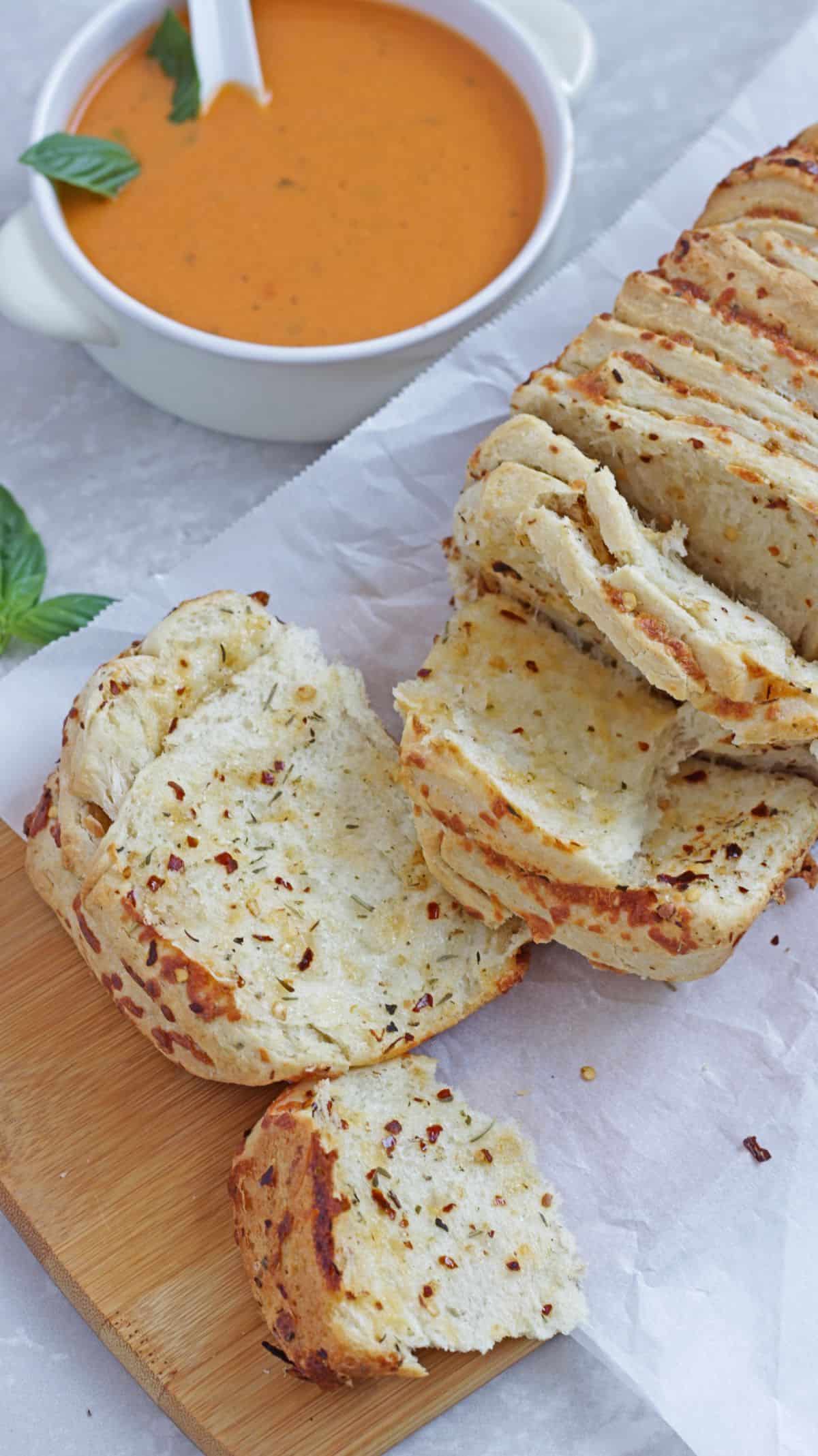 Sliced layers of pull apart bread with soup