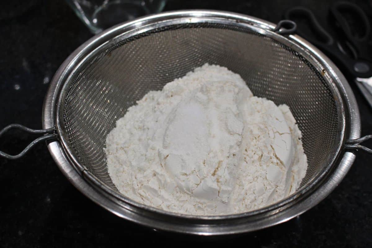 sifting flour in a bowl
