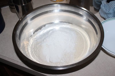 Adding the flour in a bowl