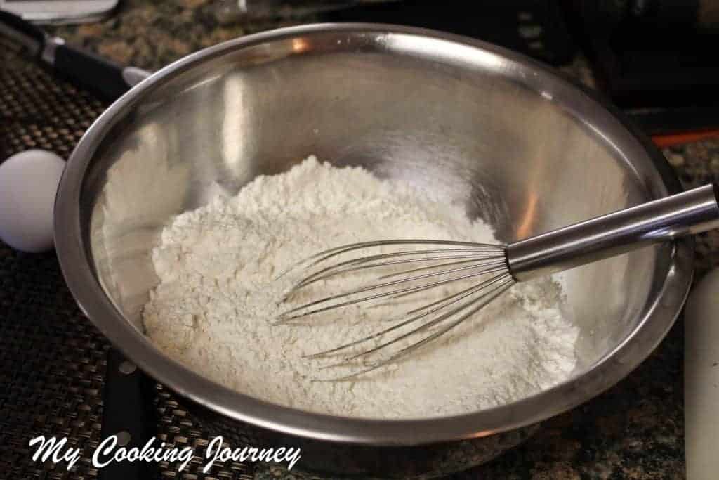 Whisking the flour in a  bowl