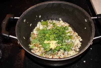 Frying onions and other ingredients in a pan