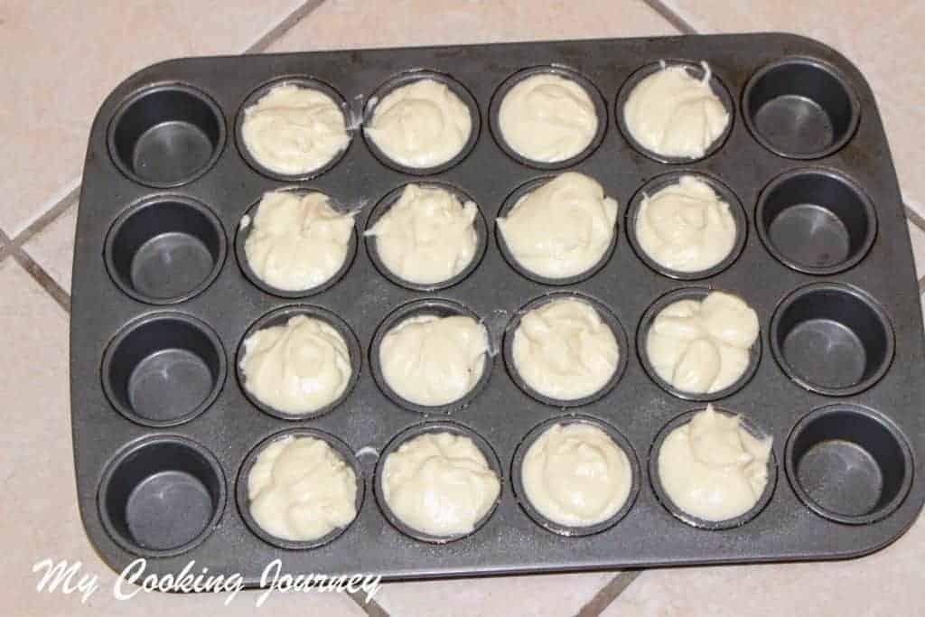 Adding the dough in Muffins tray