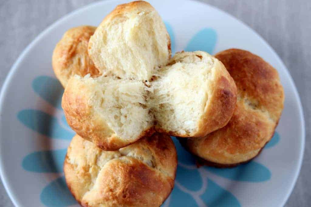 Cloverleaf Dinner Rolls cut from the middle and served in a dish