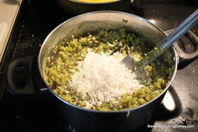 Adding grated coconut on beans