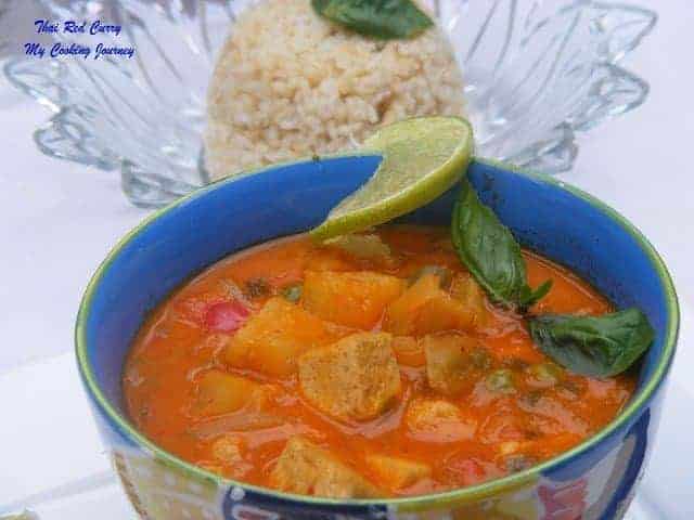 Thai Vegetable and tofu red curry is served in a bowl with rice