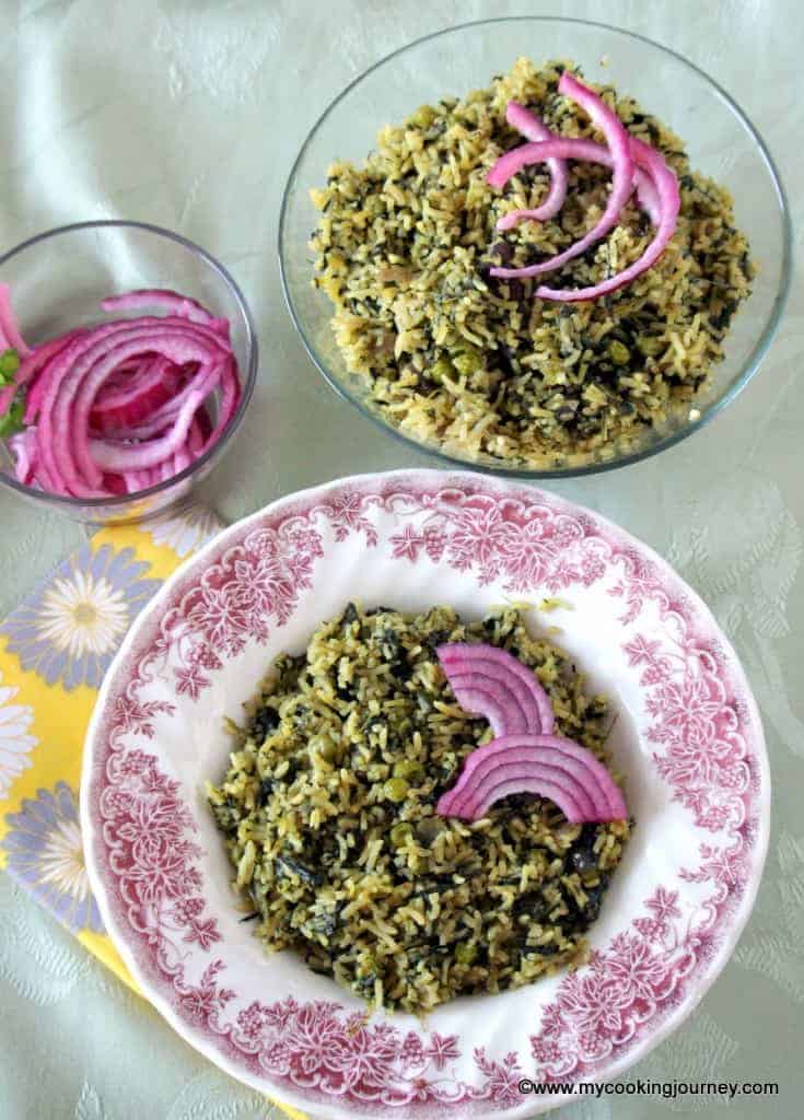 Palak mutter pulao in a bowl with onion