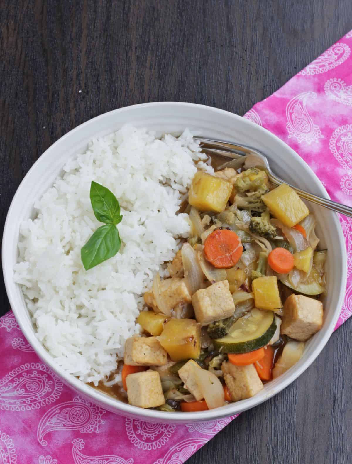 mixed vegetables and tofu in a bowl with rice