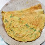 dosa stacked in a wooden plate