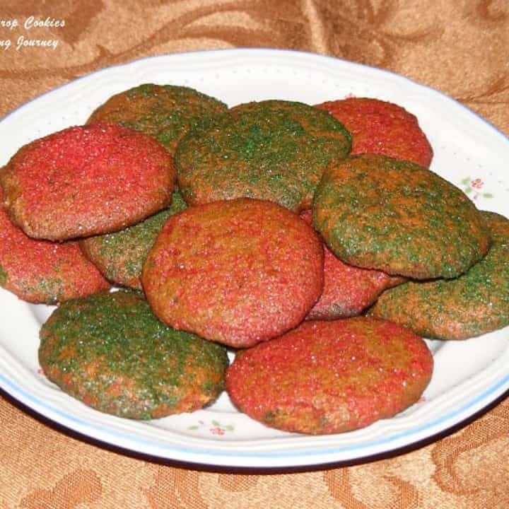 Molasses drop cookie in a white plate - Featured Image.