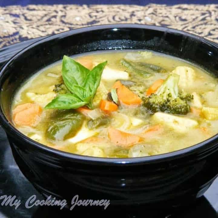 Thai Green Curry in a black bowl - Featured Image