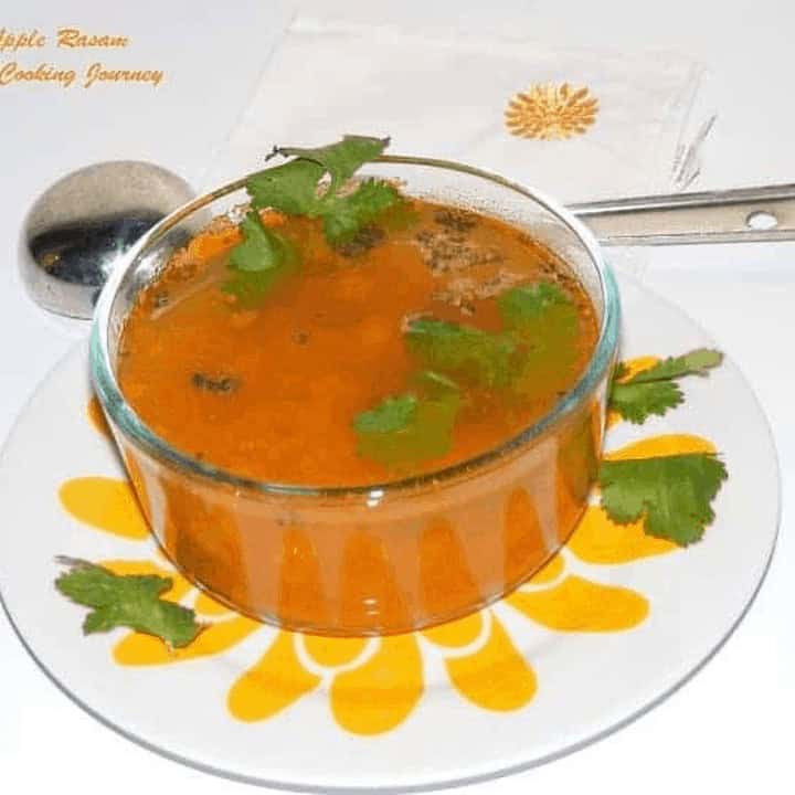 Apple Rasam in a glass bowl - Feature image